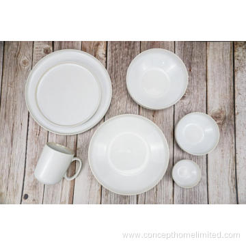 Reactive glazed stoneware dinner set in Creamy white